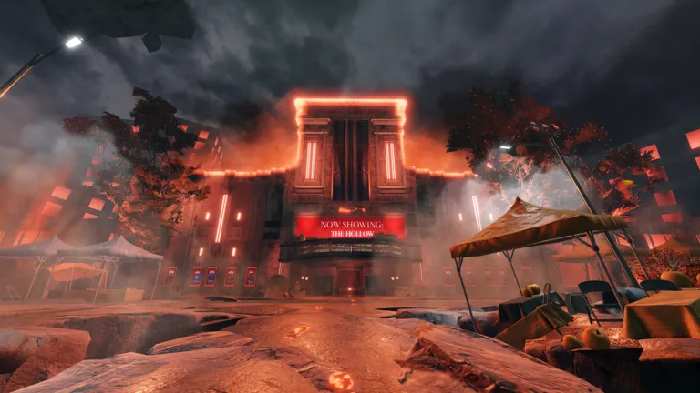 Theater marquee reading Now showing: The Hollow on a cracked street glowing orange under storm clouds