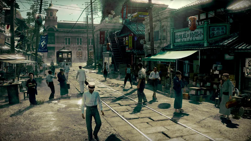 People walk along tram tracks on an early 20th-century street lined with shops and a red-brick building