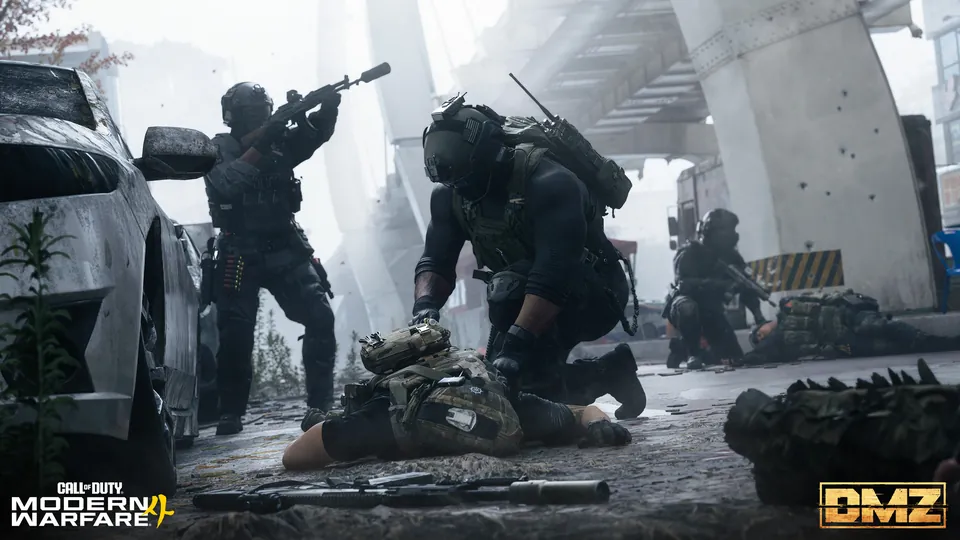 An operator kneels over a downed soldier under a concrete overpass while a squadmate aims a rifle
