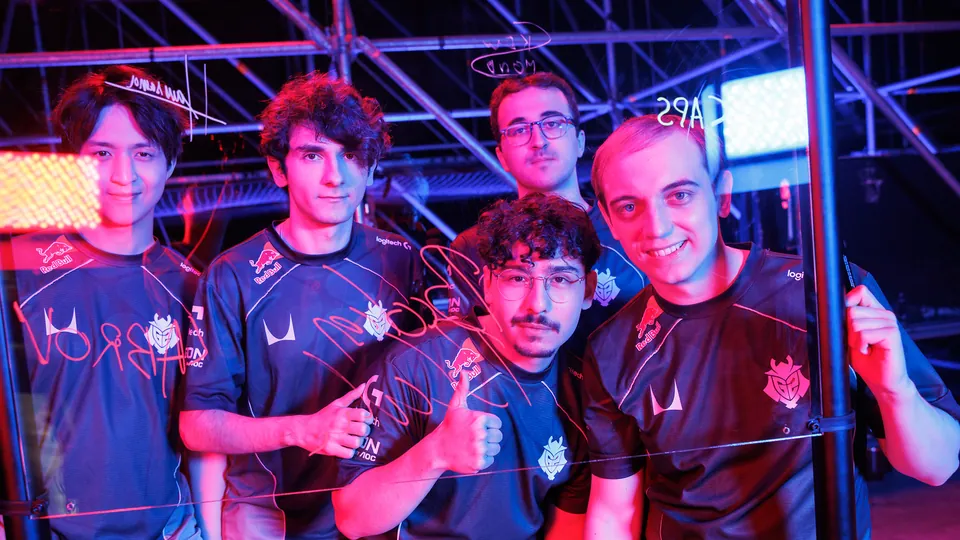G2 Esports players pose behind a glass panel they signed on day 1 of the MSI 2026 bracket stage in Daejeon, South Korea