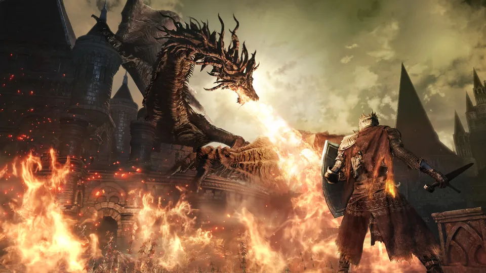 A dragon breathes fire over a burning castle as a knight with a shield stands below in Dark Souls III