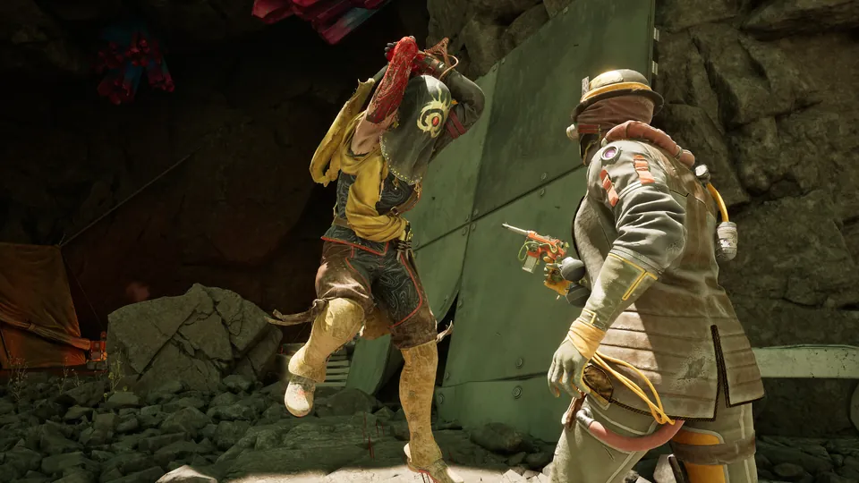 Two armored companions move through a rocky canyon with weapons drawn