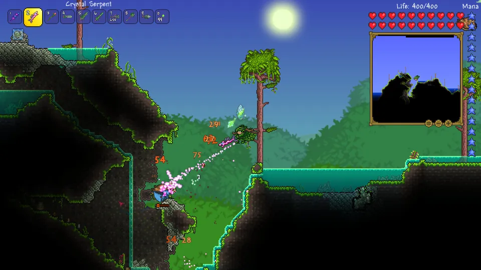 A player fights flying enemies with a crystal weapon on a jungle hillside in Terraria