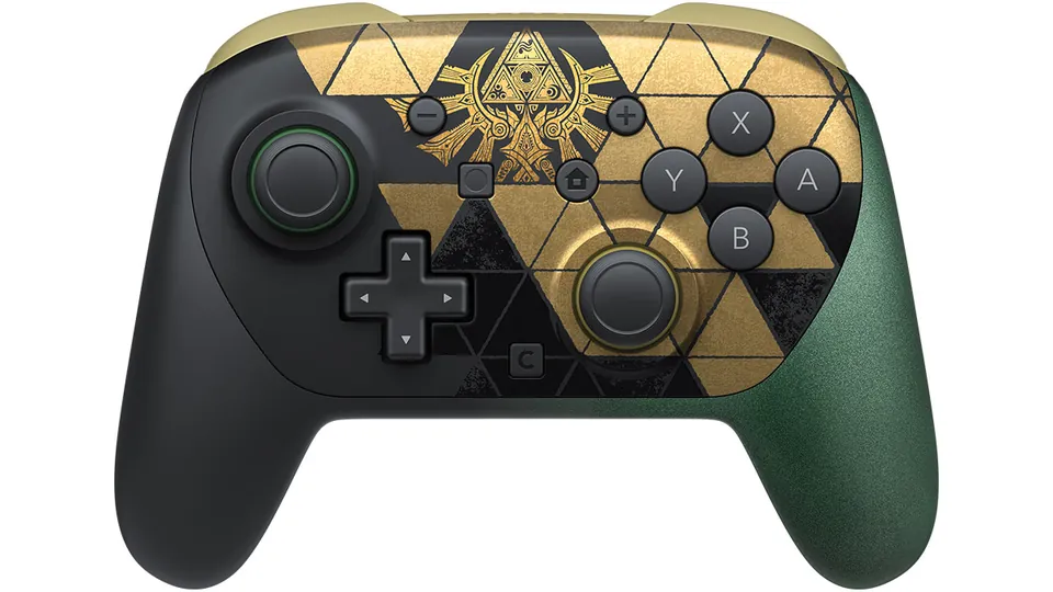 The front of the Zelda 40th Anniversary Edition Pro Controller, black and gold with a green right grip.