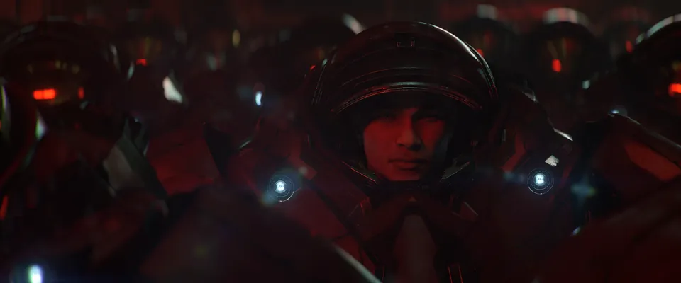 A young soldier in a red-lit armored helmet waits among other troops in the new StarCraft