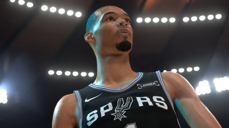 Victor Wembanyama in a San Antonio Spurs jersey under arena lights in NBA 2K27