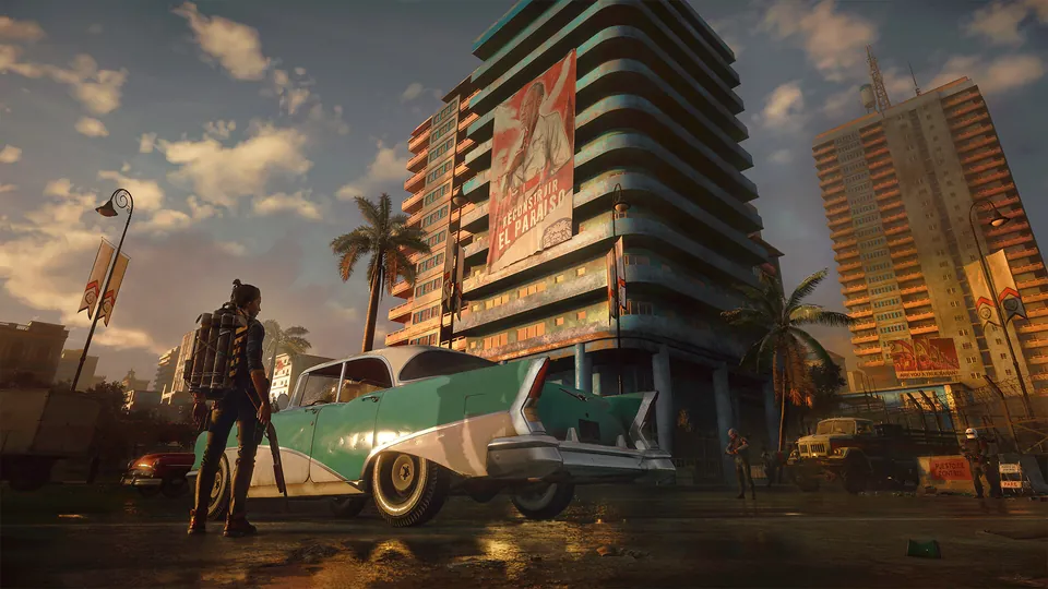 A guerrilla fighter stands by a vintage car in front of tall apartment blocks in Far Cry 6