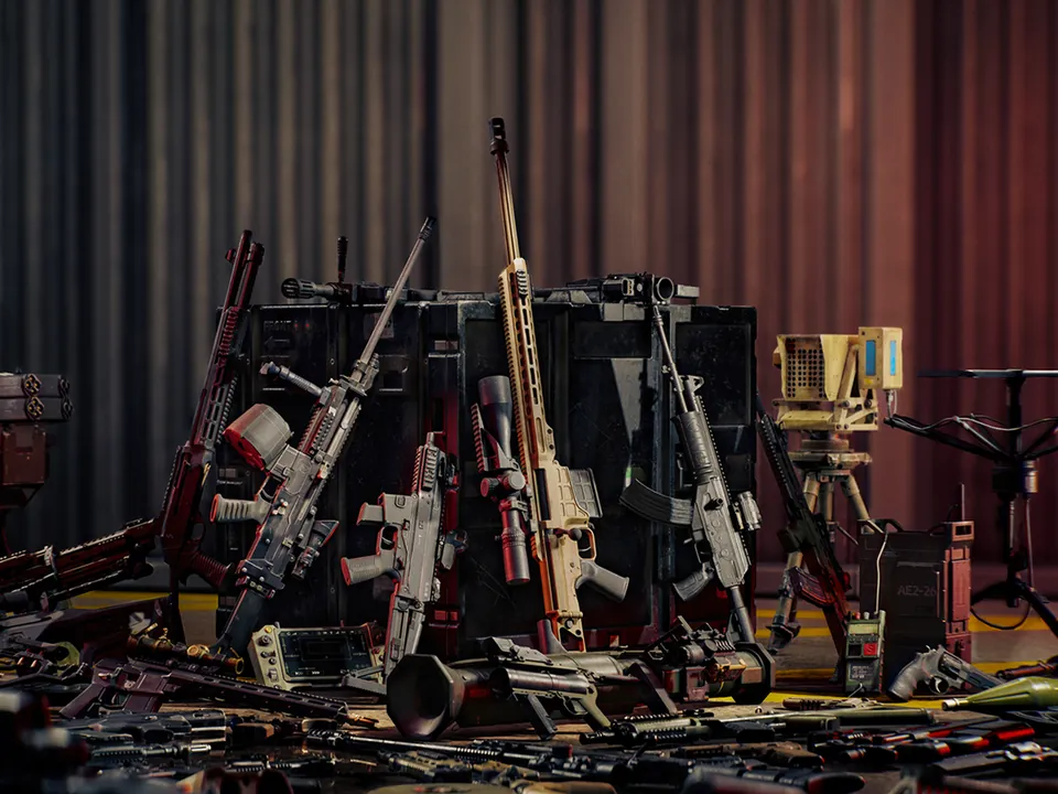 Dozens of rifles, shotguns and launchers are stacked on a stage in front of red curtains for Battlefield 6's Game of the Year Edition