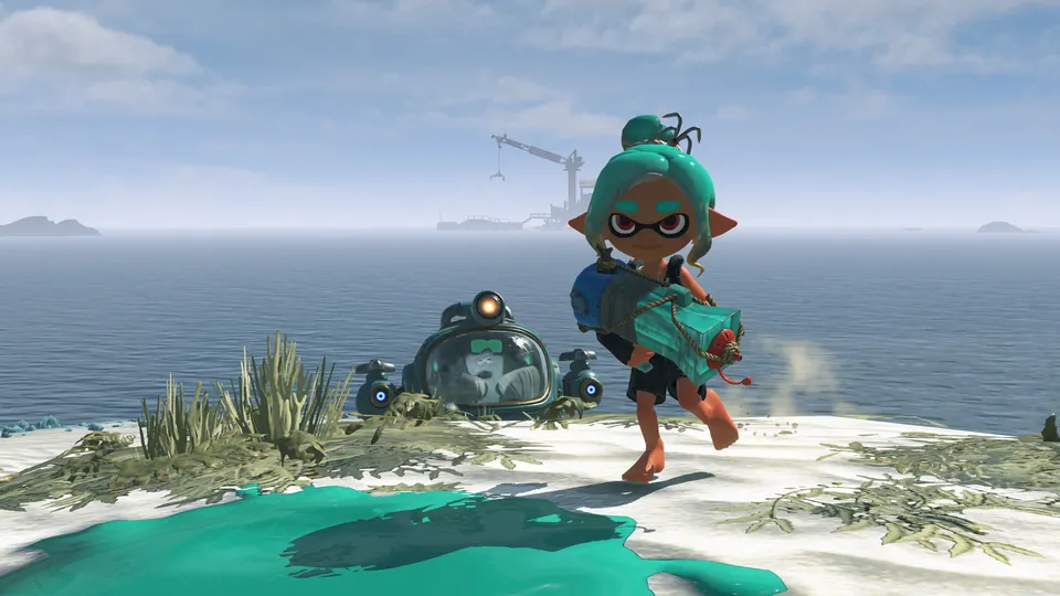 An Inkling with a teal ink blaster walks along a sandy island shore beside a small round vehicle in Splatoon Raiders on Nintendo Switch 2