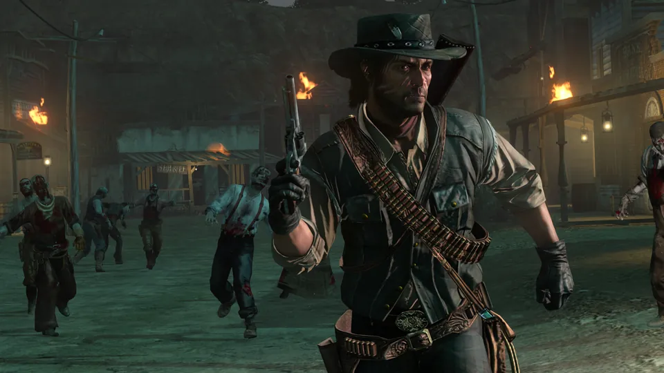 John Marston walks through a torch-lit town at night with a revolver drawn as zombies close in behind in Undead Nightmare on Nintendo Switch 2