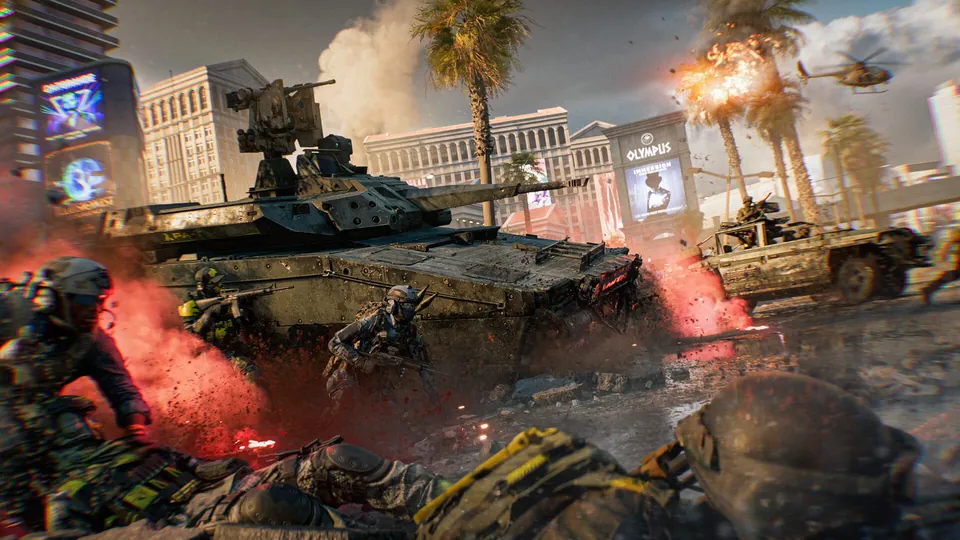 A tank rolls down a palm-lined Las Vegas street past casino signs as soldiers take cover amid red smoke in Battlefield 6