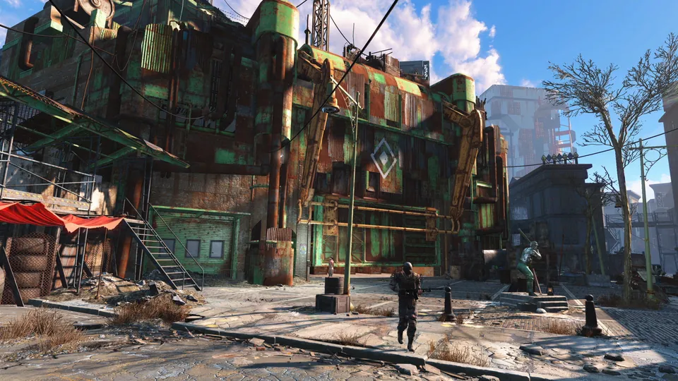 A walled settlement built from scrap metal and colorful painted panels rises above a ruined Boston street in Fallout 4
