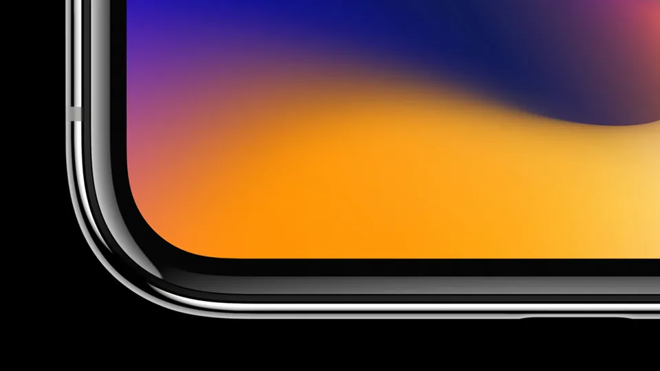 A corner of the iPhone X screen running close to the stainless steel edge
