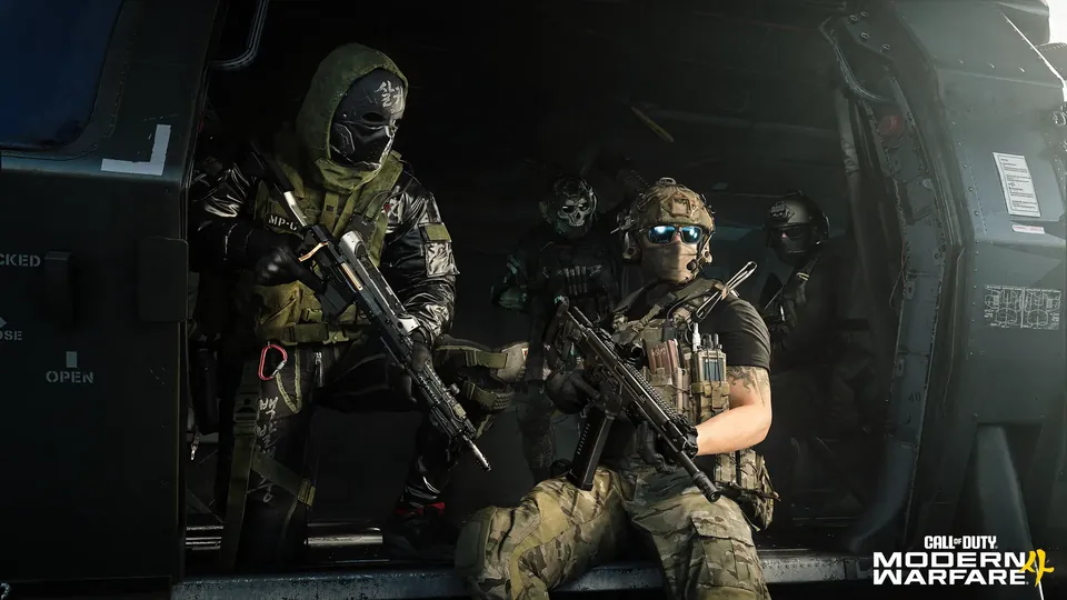 Masked operators holding rifles sit inside a helicopter cabin in Modern Warfare 4