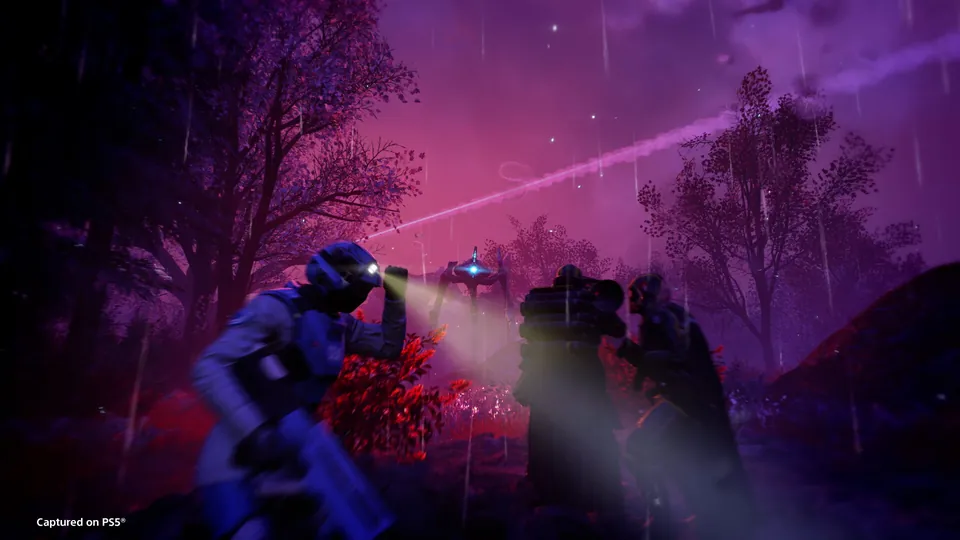 Helldivers 2 screenshot: Helldivers with flashlights move through a purple forest at night in the rain