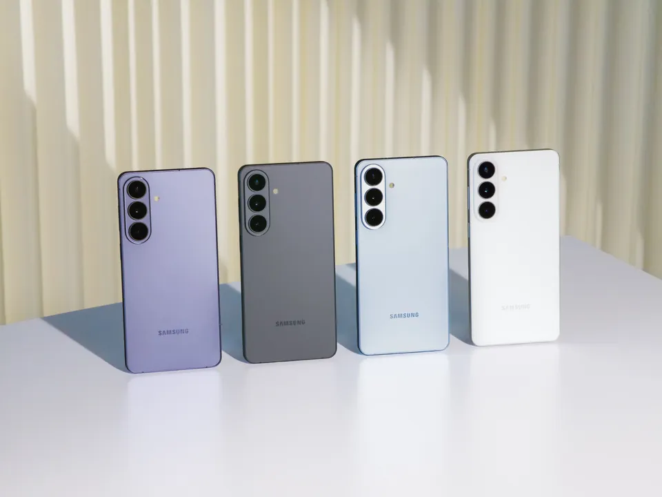 Four Galaxy S26 phones in different colors in front of a pleated curtain
