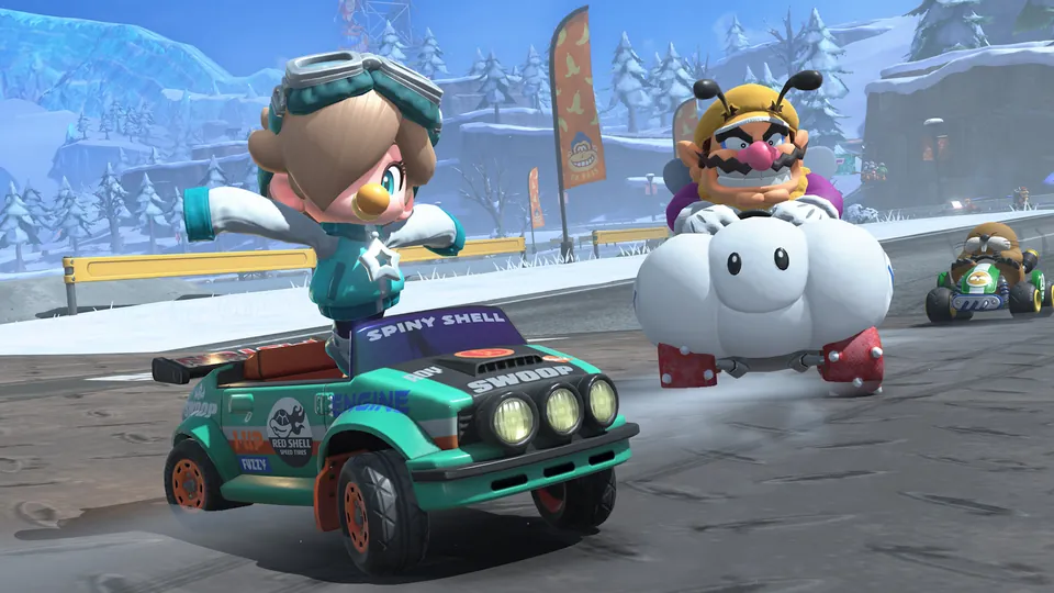 Two racers speed down a snowy road lined with pine trees during the Turnip Rally in Mario Kart World