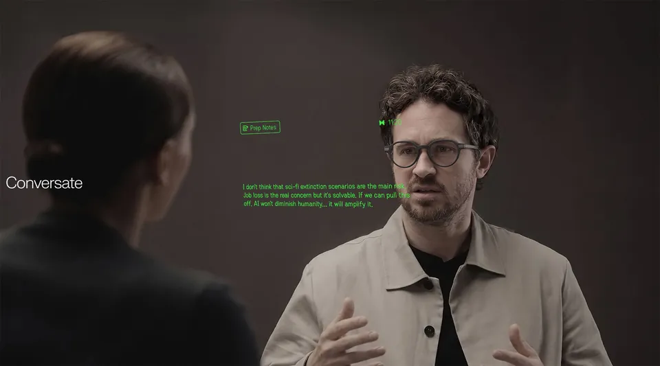 A man wearing Even G2 talks to a woman while Conversate shows green notes from the conversation