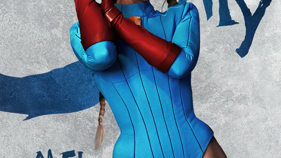 Mel Jarnson as Cammy in a blue leotard, red gloves and beret on a Street Fighter character poster