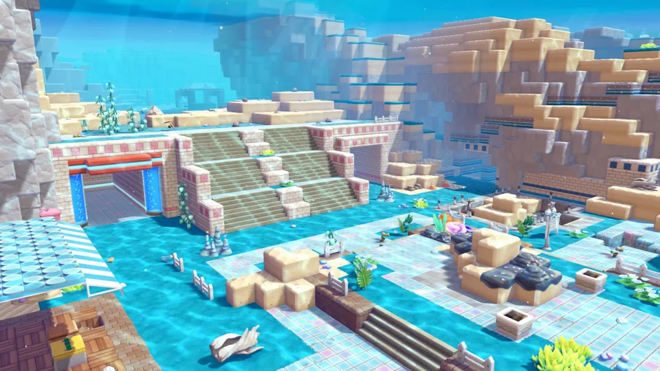 Blocky stone stairs, an arched gate and coral gardens fill the clear blue water of the underwater town Bubbly Basin in Pokémon Pokopia