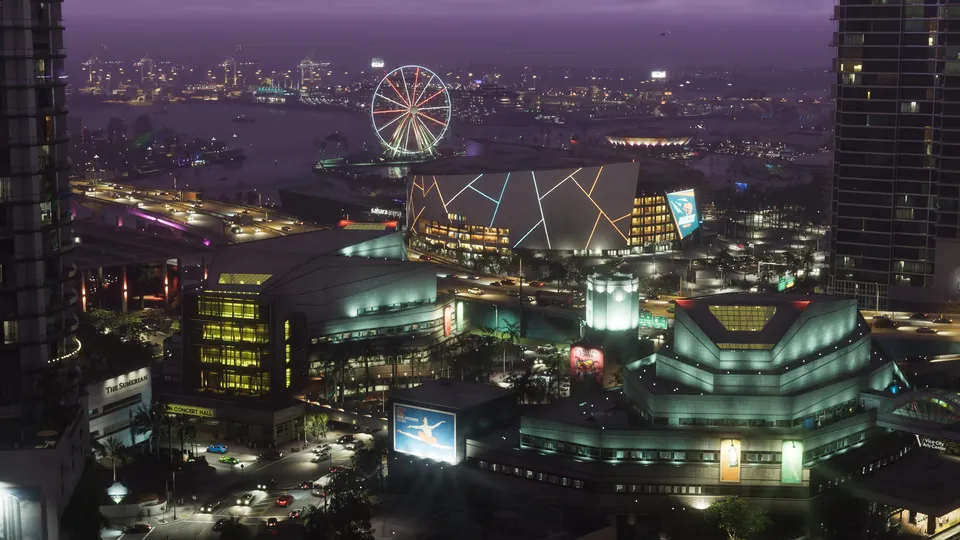 Vice City at night from above: an arena, a Ferris wheel and lit-up streets