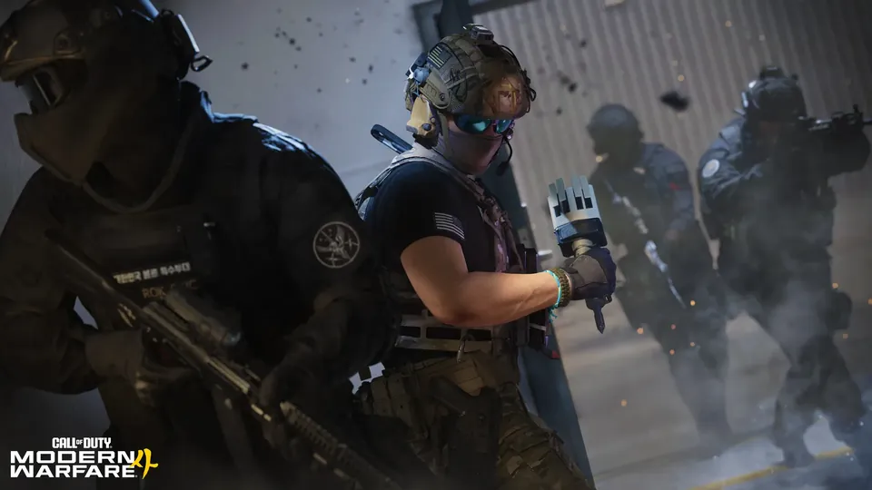 An operator in tinted goggles holds up a gadget while a squad pushes through smoke in Modern Warfare 4