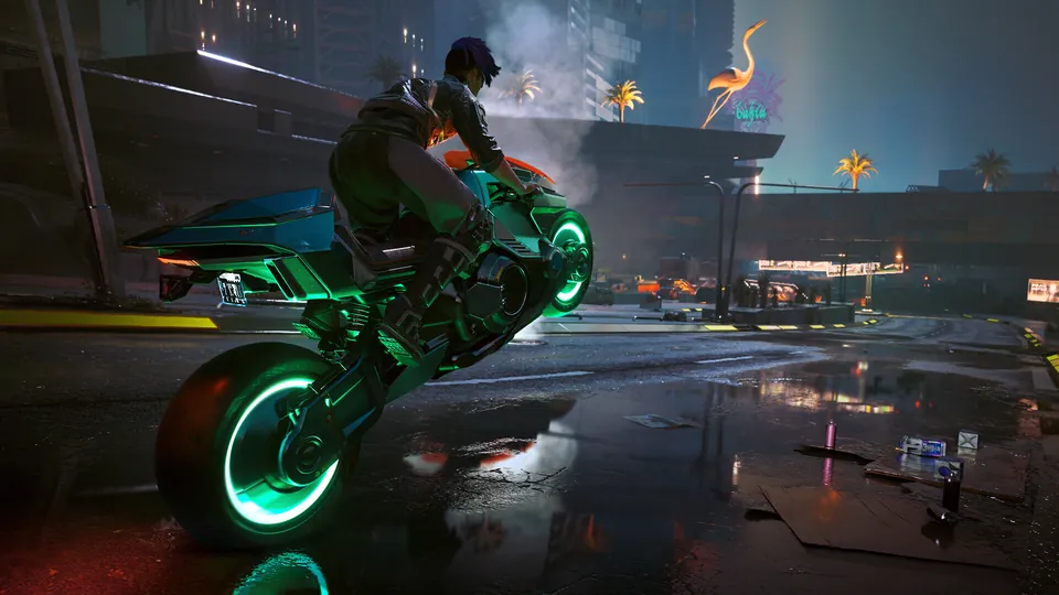 A rider on a motorcycle with glowing green wheels pops a wheelie on a wet neon-lit street in Cyberpunk 2077