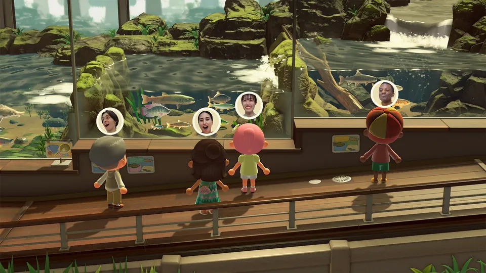 Four players look at a fish tank in the museum with small camera bubbles showing their faces above them in Animal Crossing: New Horizons