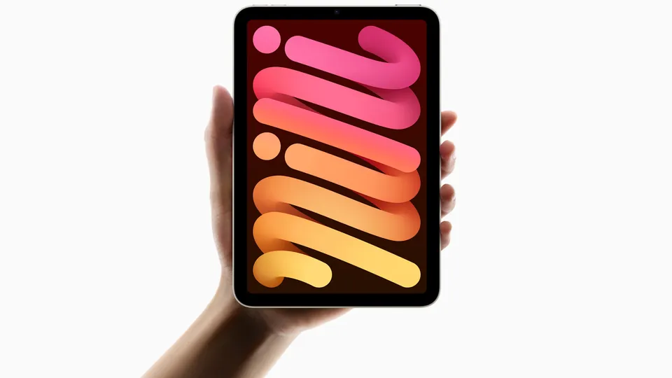 A hand holds up the iPad mini with A17 Pro