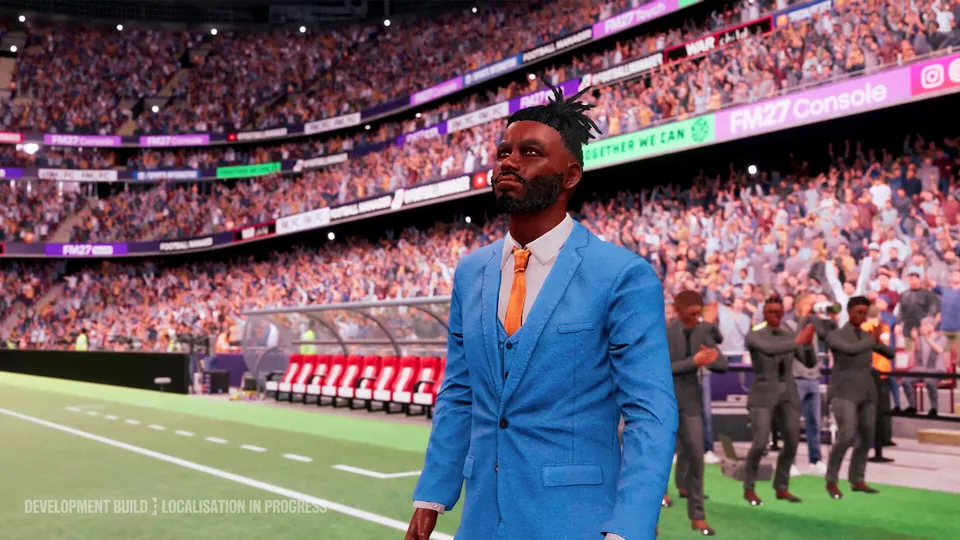 A manager in a blue suit on the touchline in a full stadium in FM27 Console