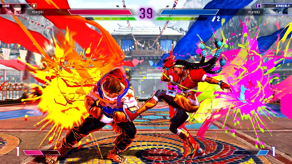 Luke and Kimberly trade blows in an explosion of yellow and pink paint during a match in Street Fighter 6 on Nintendo Switch 2