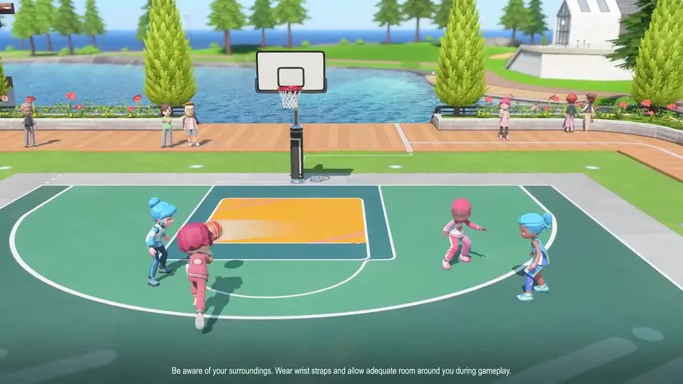 Four players run a basketball game on an outdoor court by the water on Wuhu Island