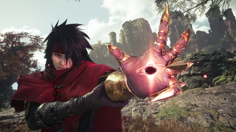 Vincent Valentine, in a red cloak and headband, raises a golden clawed gauntlet in Final Fantasy VII Revelation