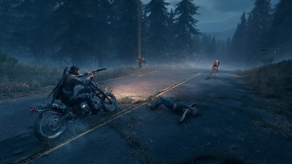 Deacon St. John fires a pistol from a motorcycle on a dark forest road in Days Gone