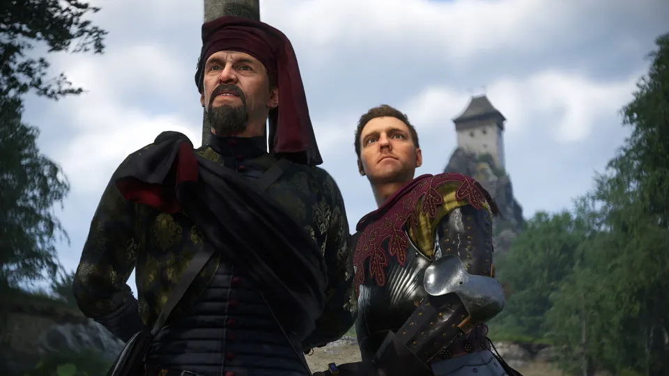 Henry in armor stands beside a bearded painter in a red hat below a stone tower