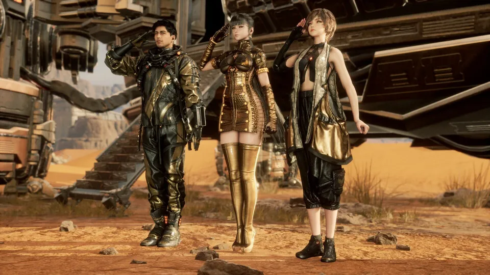 Adam, EVE and Lily pose in gold and black Stargazer outfits in front of a landing ship