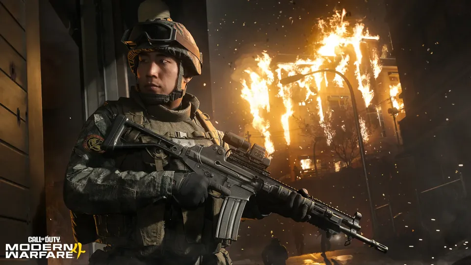 A soldier with a rifle in front of a burning building in Modern Warfare 4