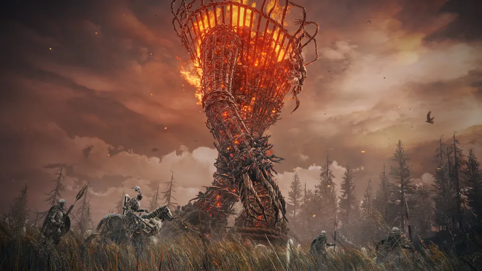 Riders approach a tall burning wicker tower under an orange sky in Elden Ring Shadow of the Erdtree