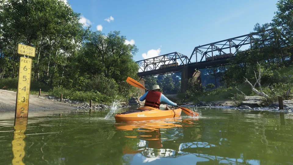 A kayaker paddles under a railway bridge in Mount Kalaga National Park, GTA 6