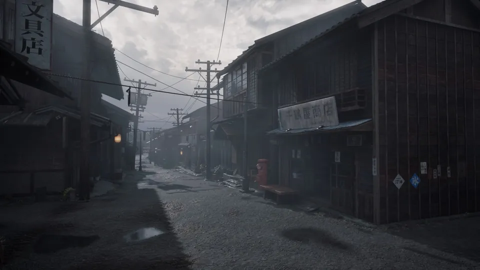 A deserted street of old wooden shops and power lines lies under gray fog in Silent Hill f