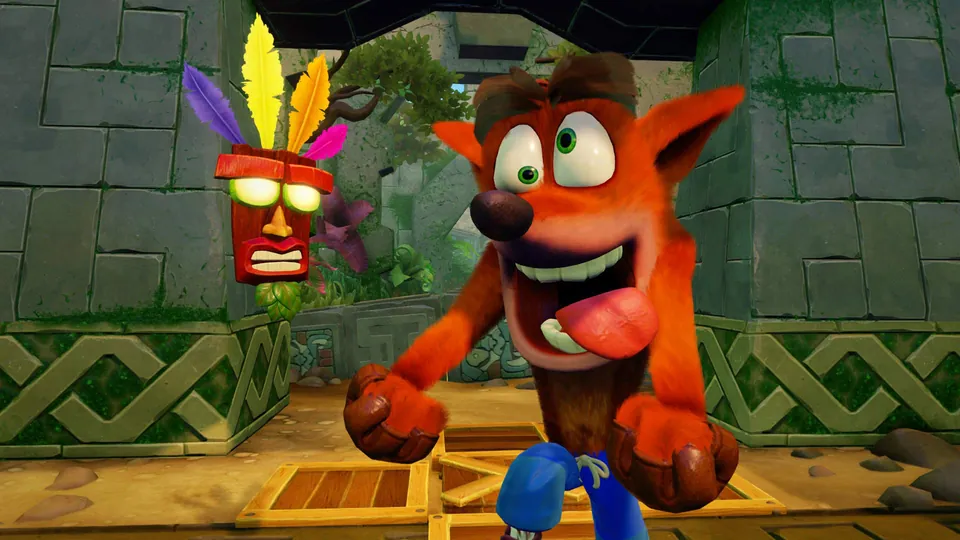 Crash Bandicoot runs toward the camera with Aku Aku floating behind in the Crash Bandicoot N. Sane Trilogy