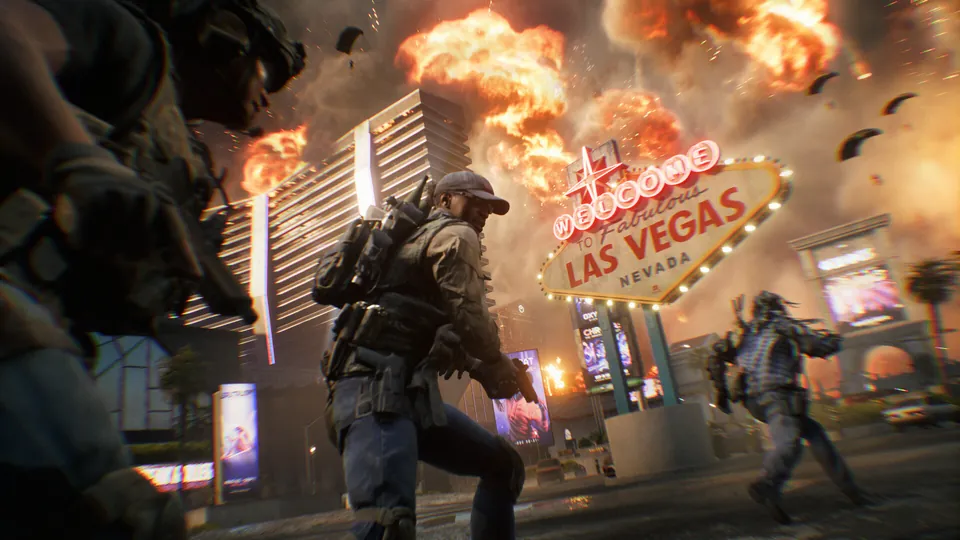 Soldiers advance past the Welcome to Las Vegas sign as buildings burn in Battlefield 6