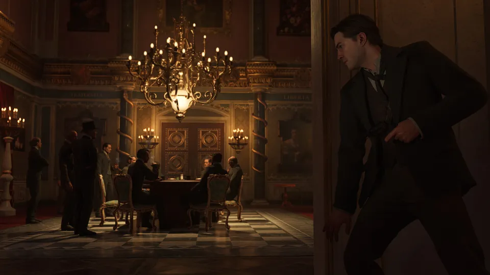 Men in suits sit at a card table under a chandelier while a man with a pistol waits by the door